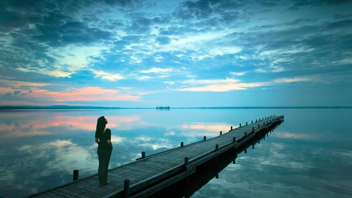woman on a solitary bridge contemplating life