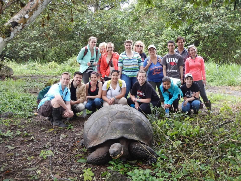 UIW students with tortoise in Ecuador and Galapagos 2014